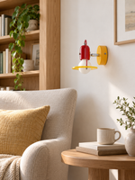 Yellow acrylic ring wall light in reading corner