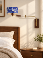 Starry Sky swing-arm wall light in a bedroom setting