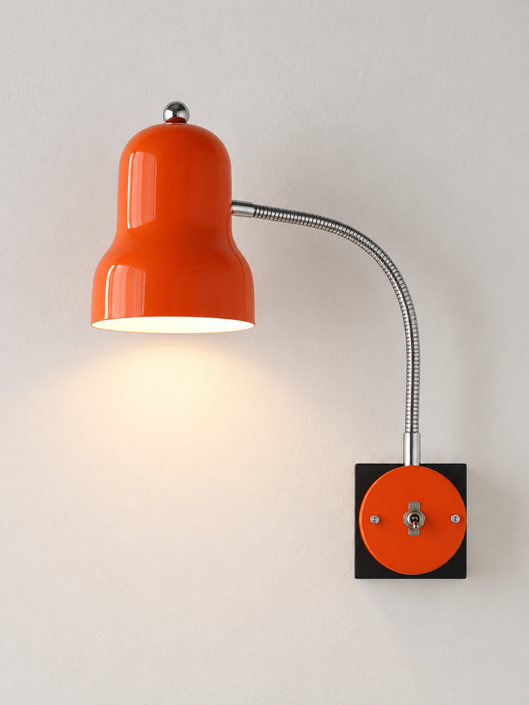 Orange gooseneck wall light with Type 86 square mounting plate