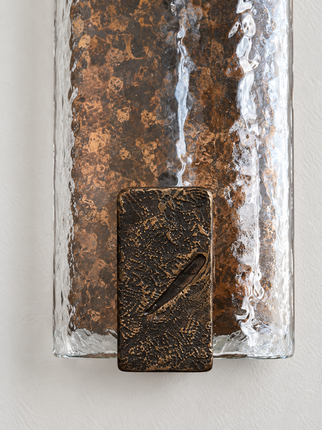 Clear hammered glass and copper-toned cast-metal detail