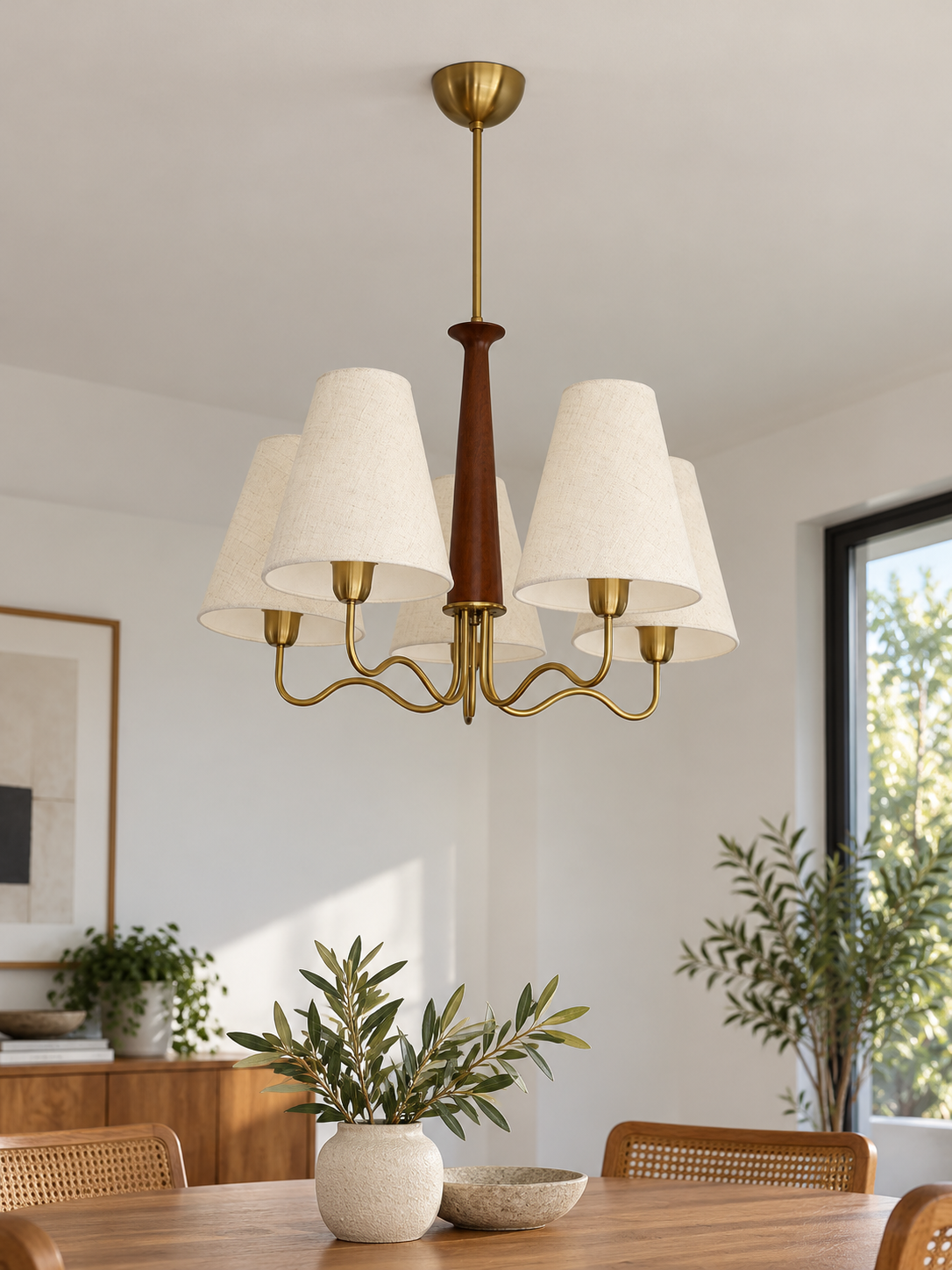Five-light wood and fabric chandelier over a daylight dining table