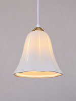 Copper-tone cap and glossy ceramic bell shade detail