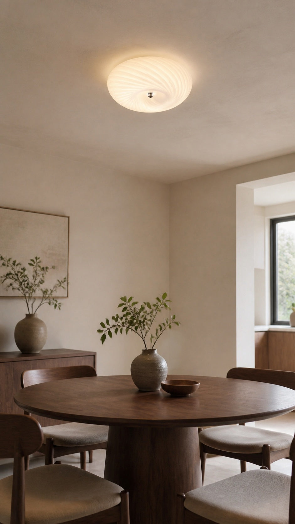 Serein Spiral Ceiling Light above a modern dining table