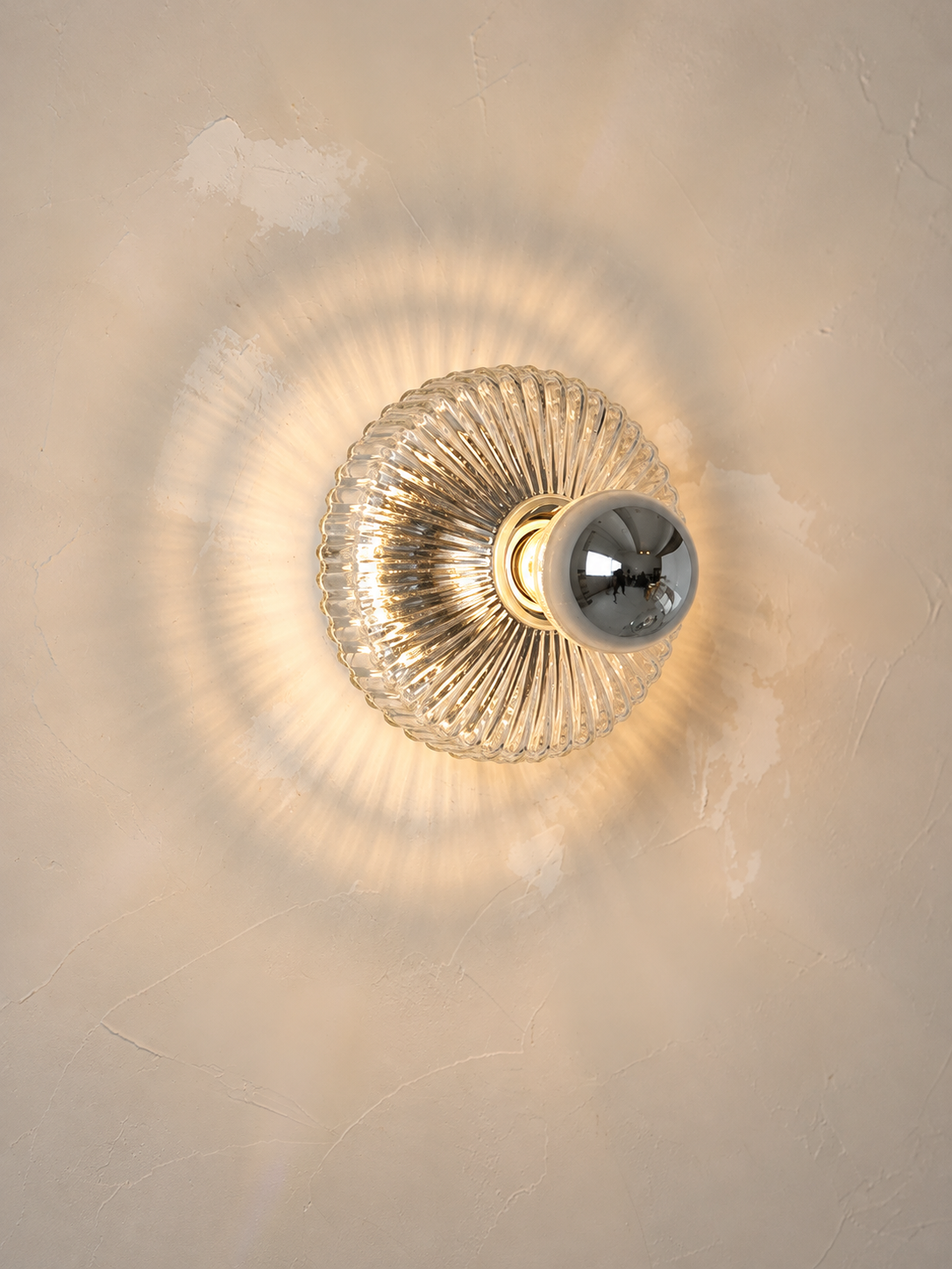 Hardwired fluted clear glass wall light without external cord