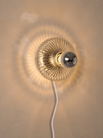Plug-in fluted glass wall light with white power cord