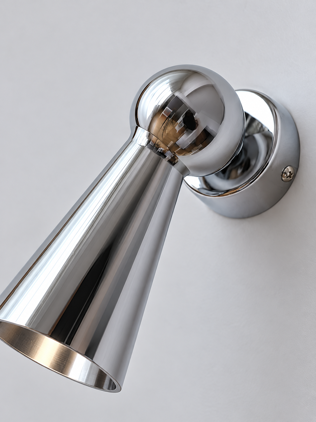 Detail of chrome spherical joint and wall backplate