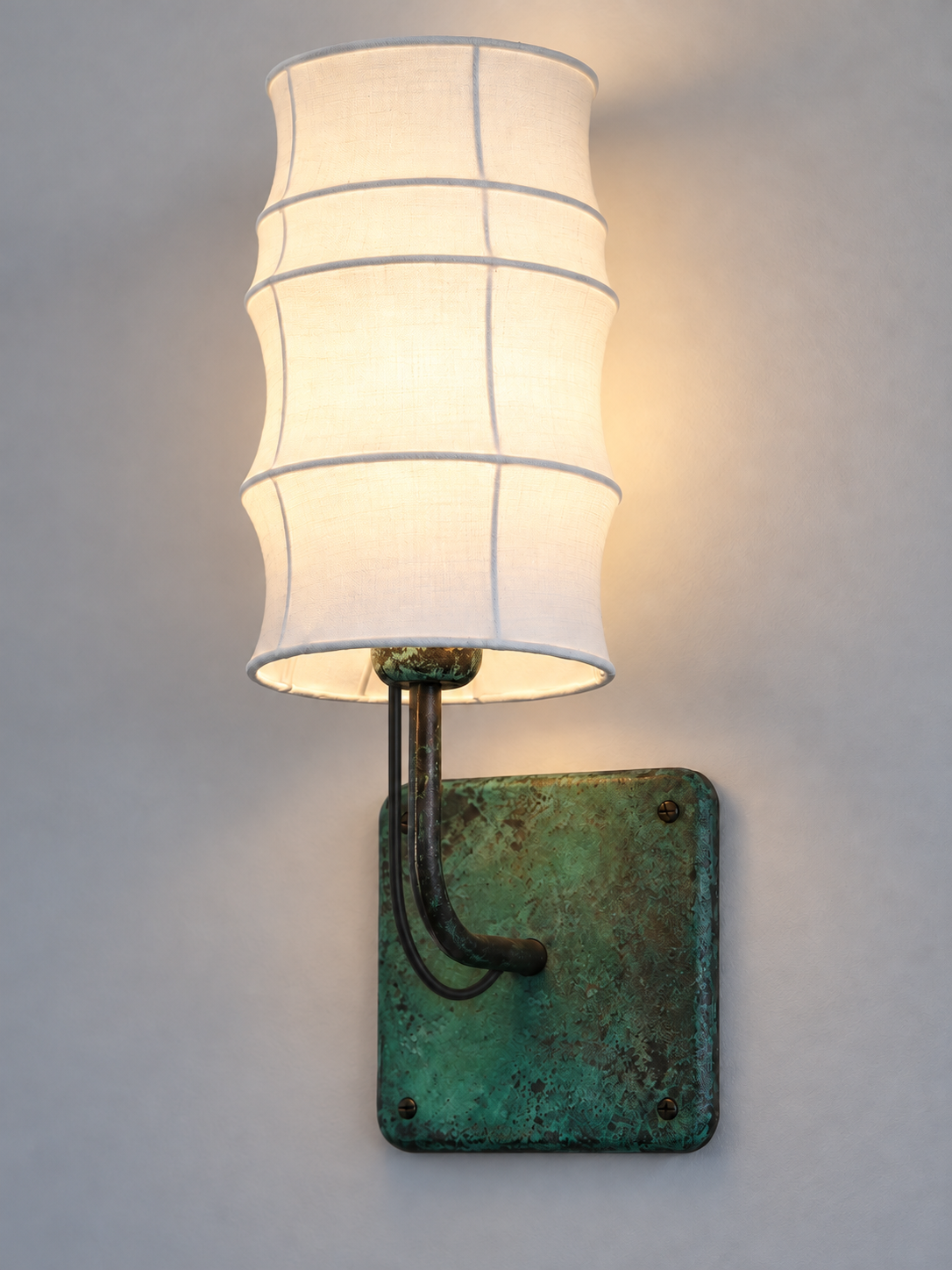 Patinated copper wallplate and curved arm detail