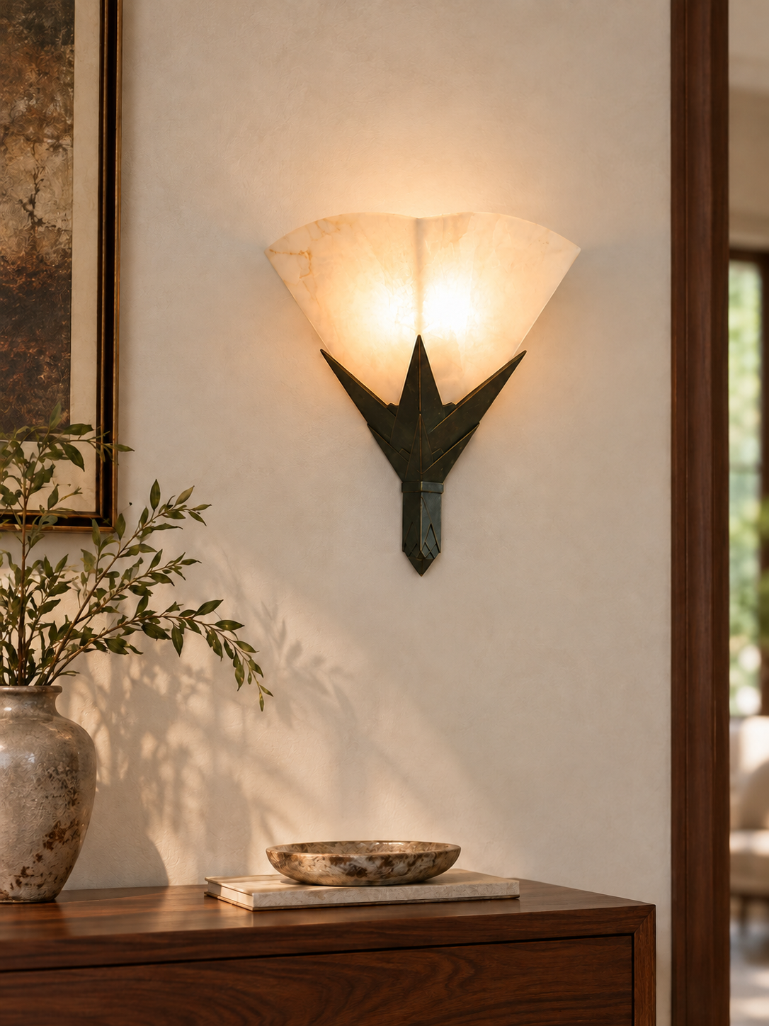 Marble Fan Wall Sconce illuminated above a walnut console