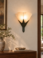 Marble Fan Wall Sconce illuminated above a walnut console