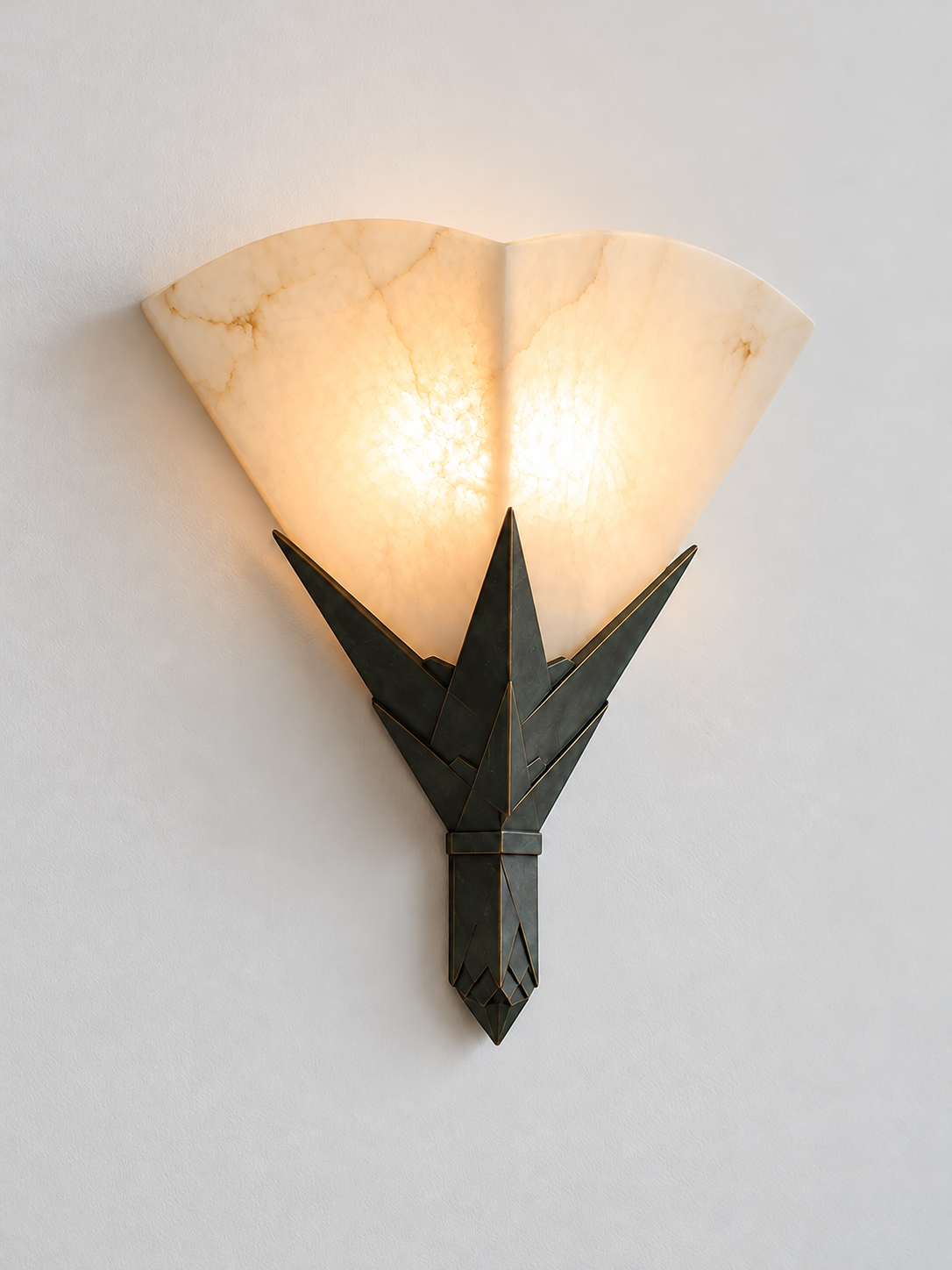 Angled view of illuminated Marble Fan Wall Sconce