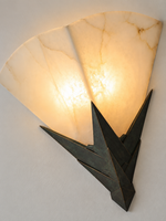Close detail of veined marble and aged bronze-tone metal