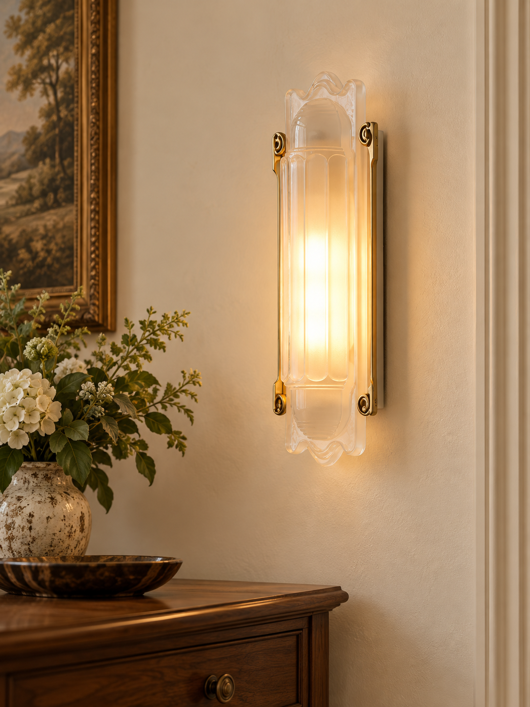 Scroll Edge glass wall sconce with copper-tone rails in a warm sitting room