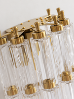 Close-up of clear textured glass, copper-tone caps, supports and upright finials