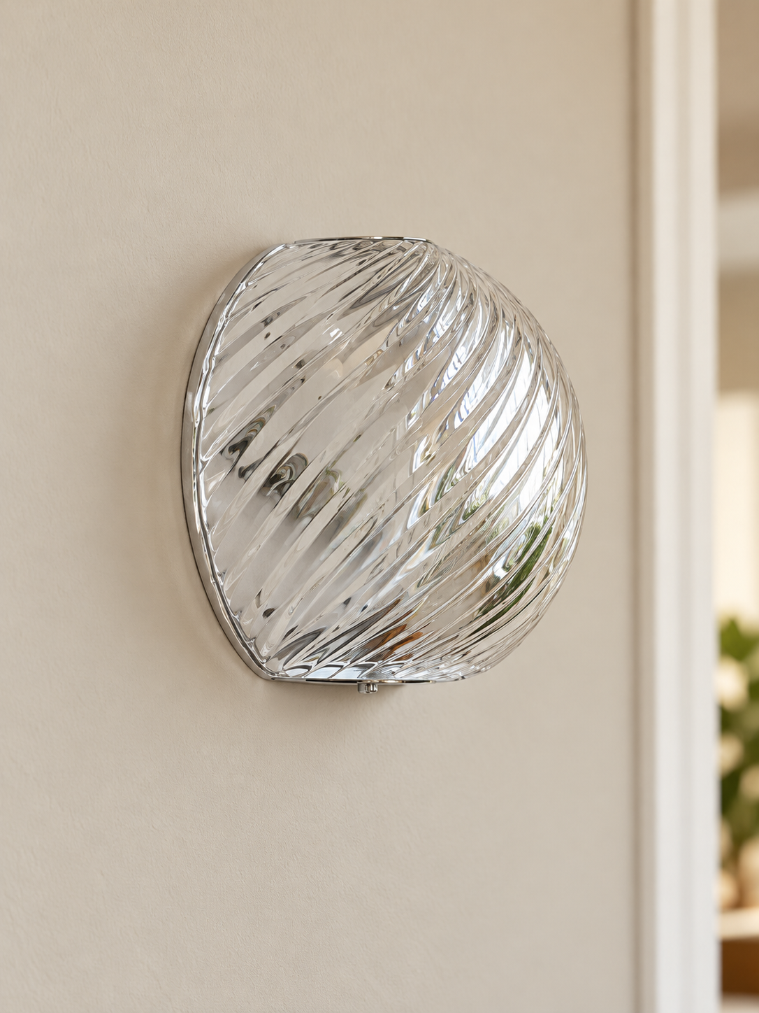 Spiral glass wall sconce in Clear glass with polished chrome hardware, shown unlit