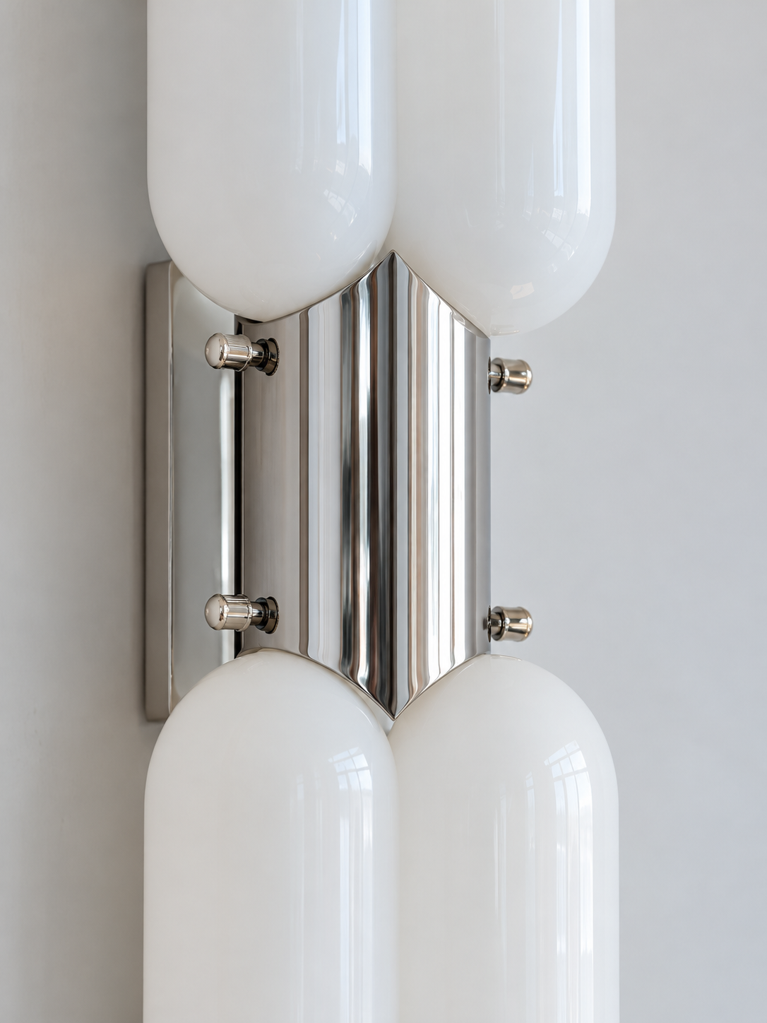 Detail of chrome housing, rounded opal glass and side fasteners