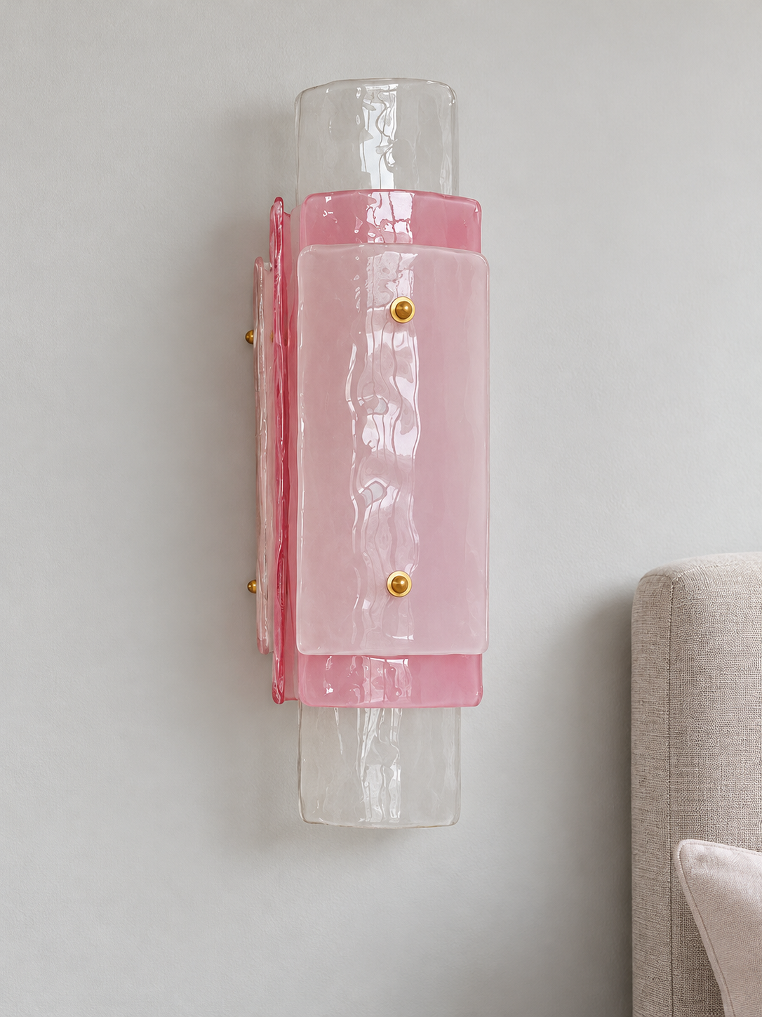 Layered Glass Wall Sconce in Pink with staggered glass panels and copper-tone fasteners