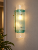 Blue Layered Glass Wall Sconce illuminated with warm light on a taupe wall