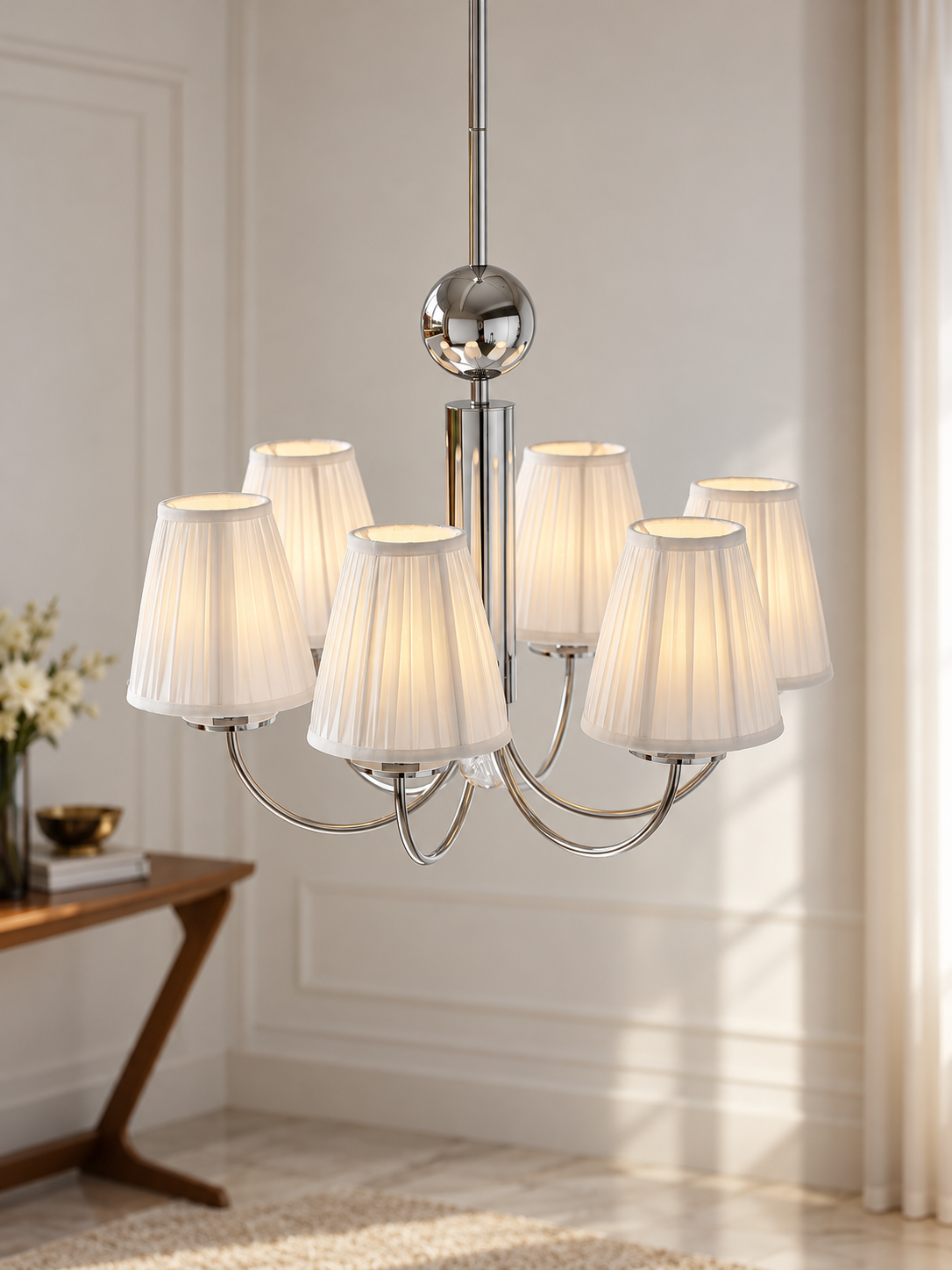 Six-light chrome pleated fabric chandelier in elegant interior