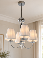 Four-light chrome chandelier with white pleated shades