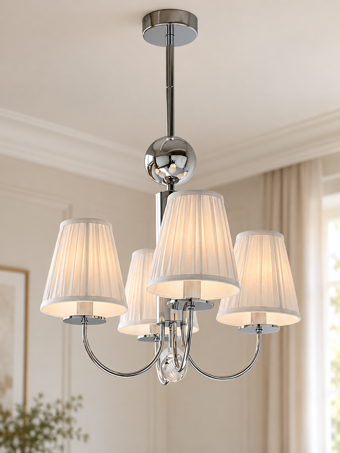 Four-light chrome chandelier with white pleated shades