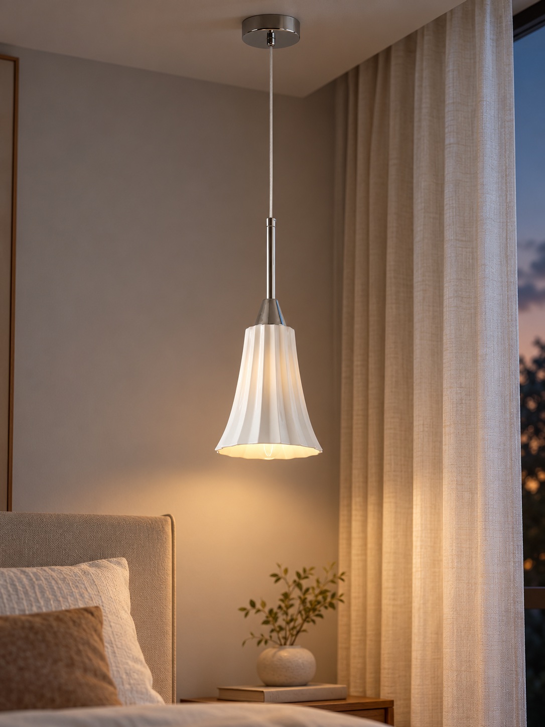 Chrome and white ceramic pendant with gentle downward light beside bedroom curtains