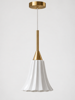 Close product view of the glossy white fluted ceramic shade and copper-tone pendant hardware