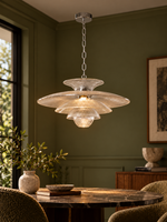 Illuminated tiered glass pendant in an olive interior