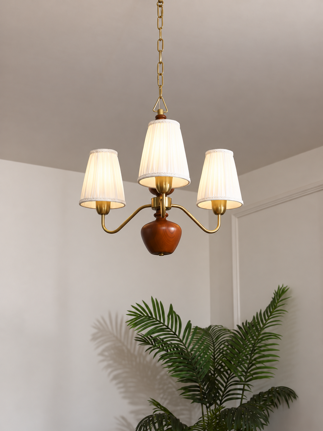 MD4596 3-light chandelier with white pleated fabric shades, copper-tone arms and walnut-colored wood