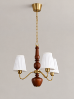 MD4596 3-light chandelier with white pleated fabric shades, copper-tone arms and walnut-colored wood
