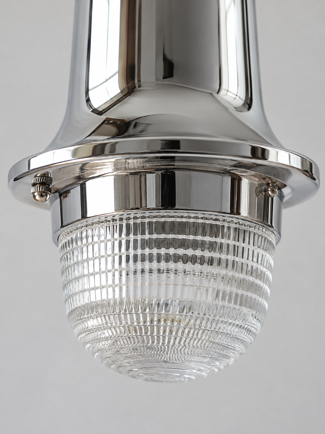Close detail of prismatic glass dome, chrome collar and retaining screws