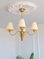 MD4707 4-light chandelier with cream pleated shades and tapered wood center