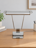 Front view of the Chrome Line table lamp with slim metal supports