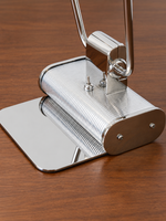 Close-up of the Chrome Line lamp ribbed base and polished hardware