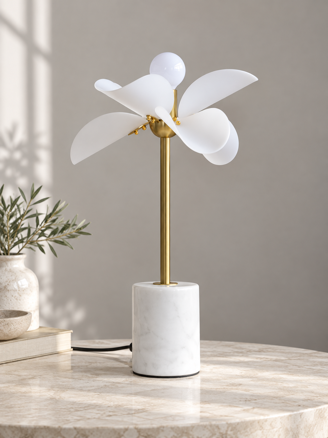 Unlit Petal Stem table lamp showing white acrylic petals and cylindrical marble base