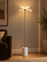 Petal Stem floor lamp softly illuminating an evening living room