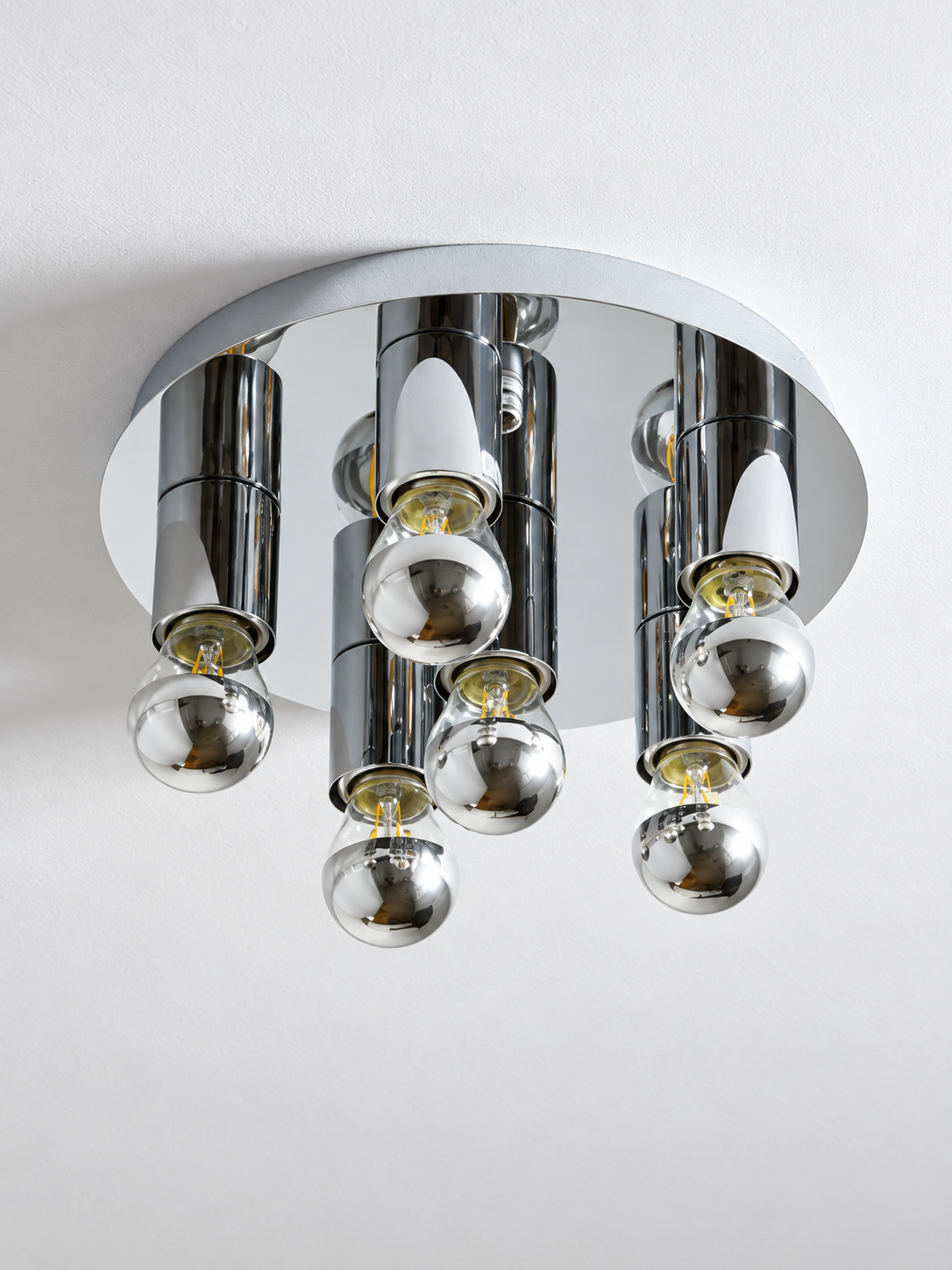 Clear glass and mirrored lower halves of six half-chrome bulbs