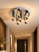 Chrome six-globe ceiling light in a warm hallway