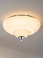 Close view of the stepped opal glass shade and chrome cap