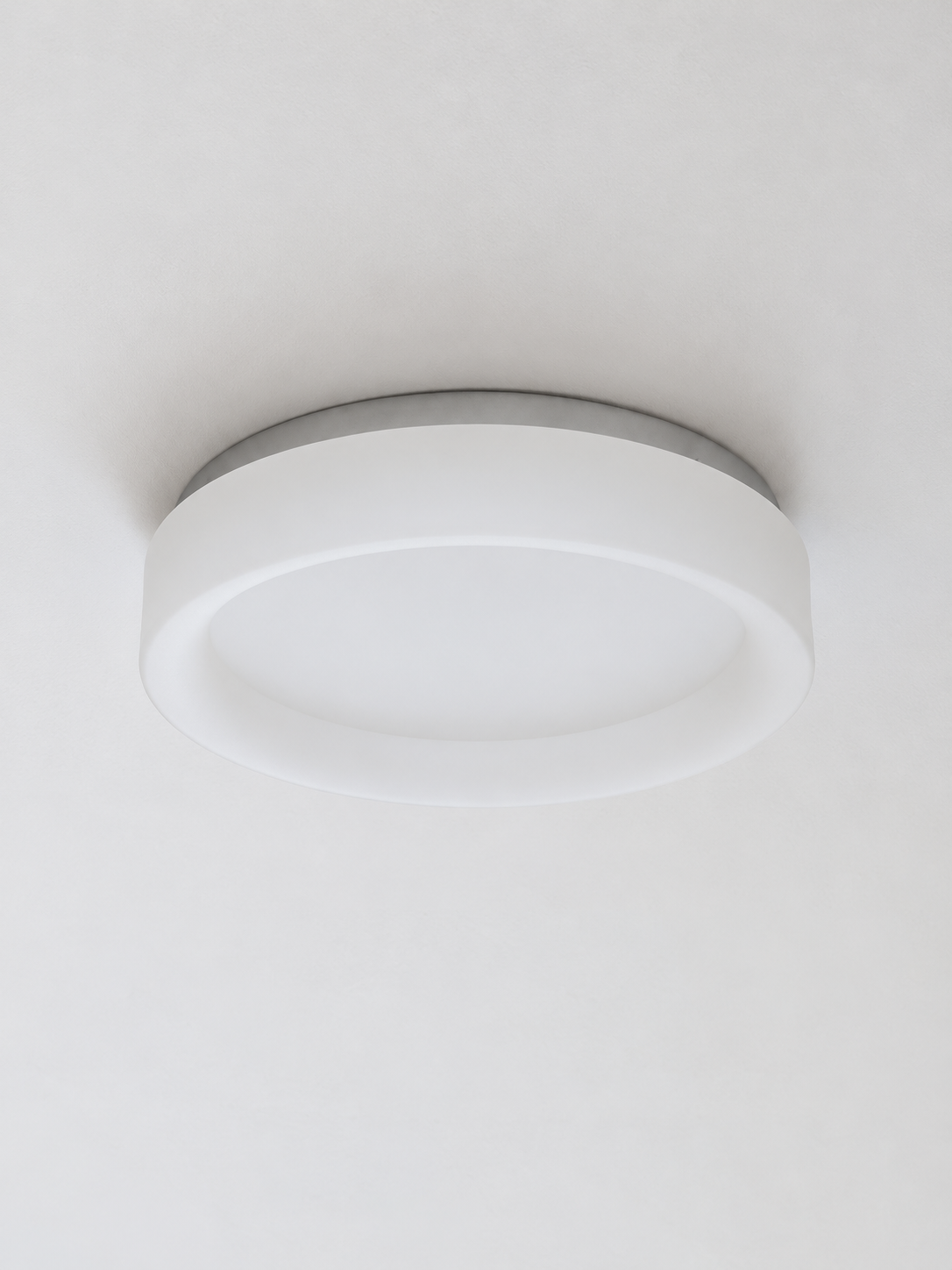 Halo Rim ceiling light in smooth frosted white with silver mounting plate