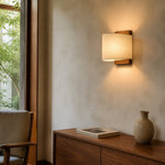 Lifestyle scene: wall sconce by window and console